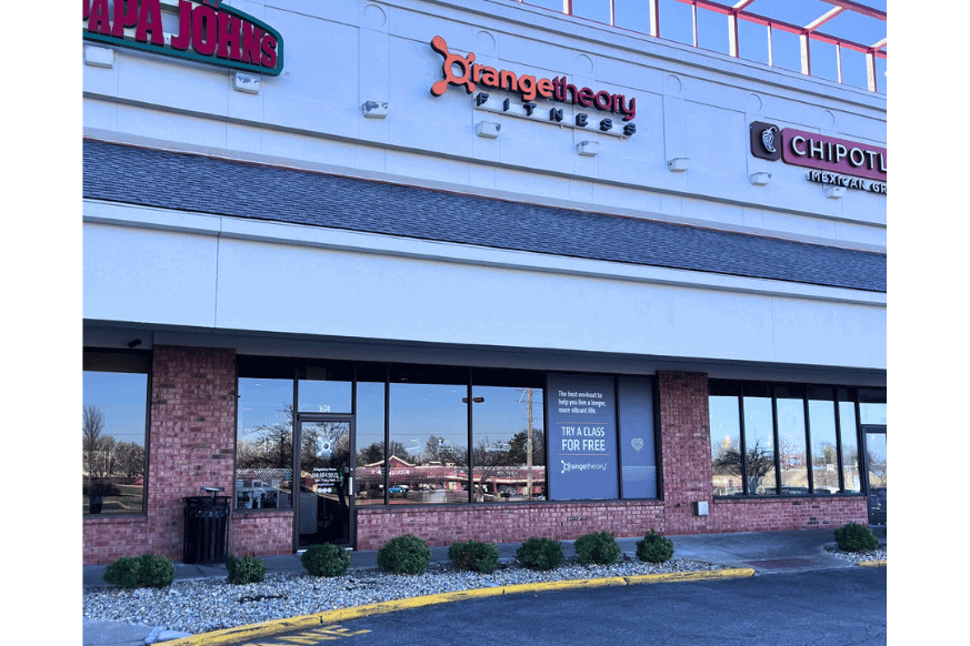 The exterior of an Orangetheory Fitness in Chesterfield.  This location is located in a strip mall in between a  Chiptole and a Papa Johns.  