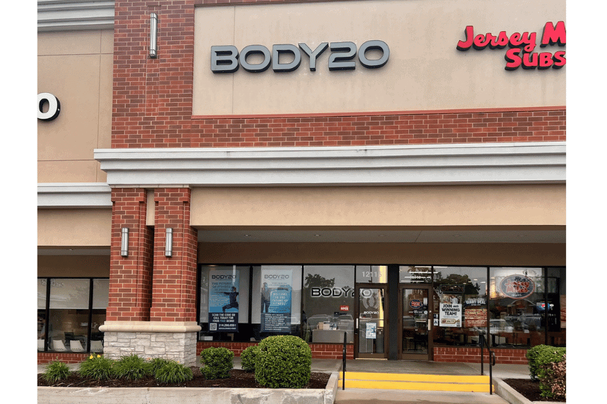 Strip mall showing the new storefront of Body20.  Full wall of windows with Body20 signage. 
 Jersey Mikes Subs is to the right.  