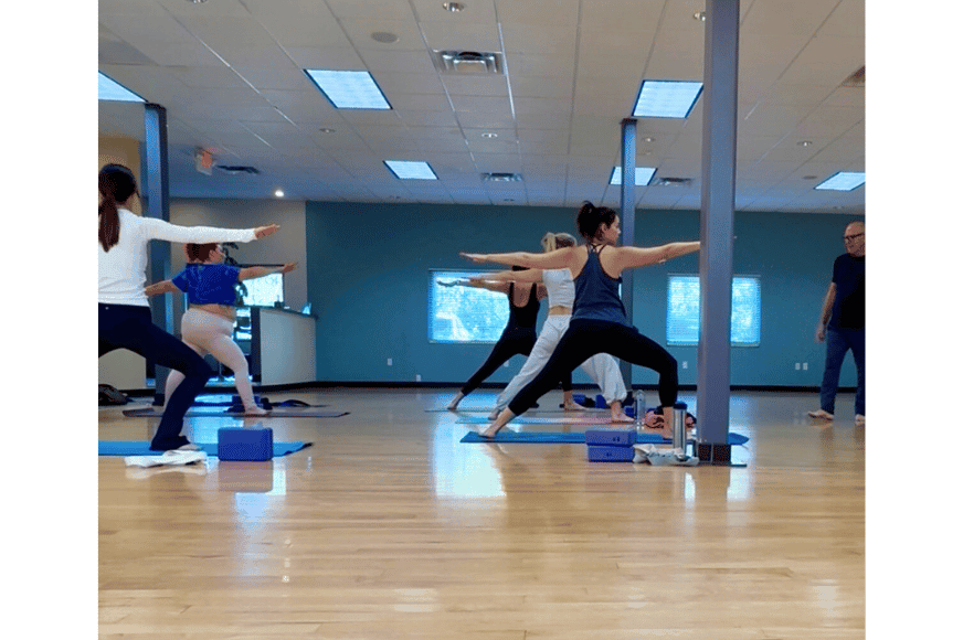 yoga class pose warrior two