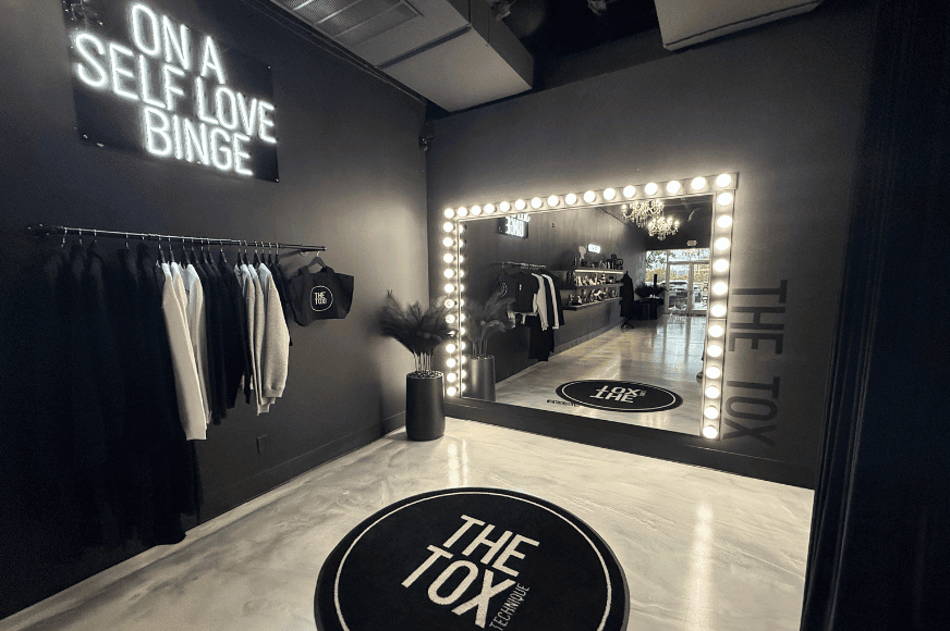a large lit up mirror stands at the back of the tox in chesterfield, offering detox massage and treatments