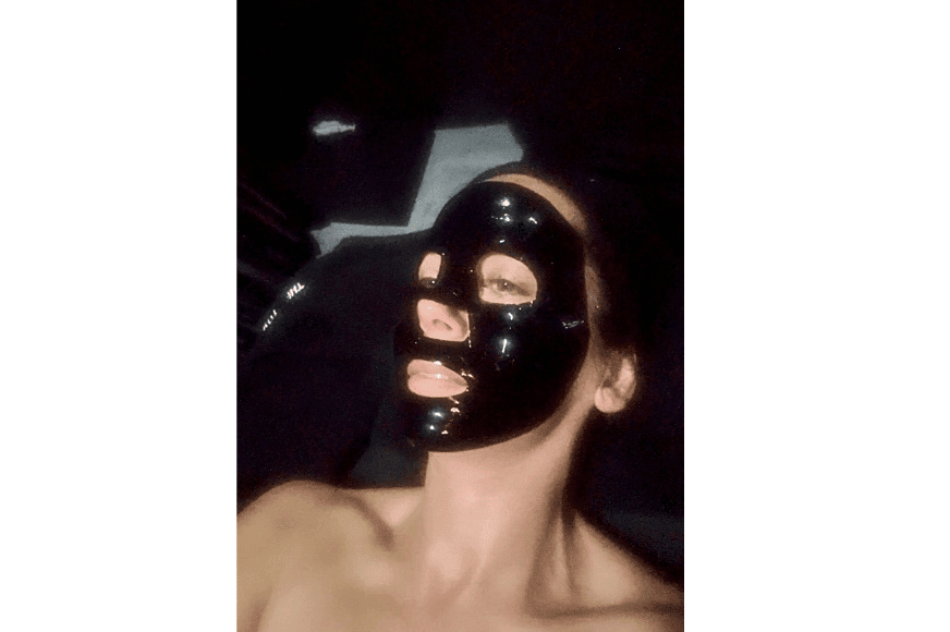 white women with a black face mask shown after experiencing the sculpting facial at the tox in chesterfield