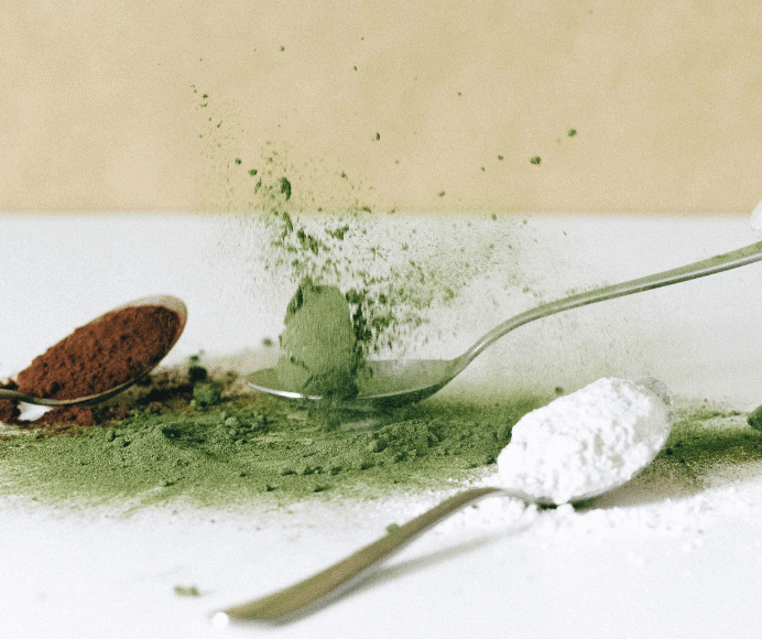 3 spoonfuls of powder - one brown, one green and one white